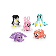 LINXO Character from MAKE IT REAL featuring colorful objects in pink, purple, orange, yellow, and black with ears and eyes.