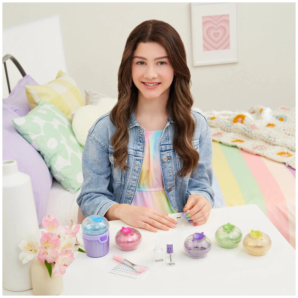 Party Nails Glitter Nail Studio with colorful nail polish bottles beside a young girl in a denim jacket and rainbow shirt.