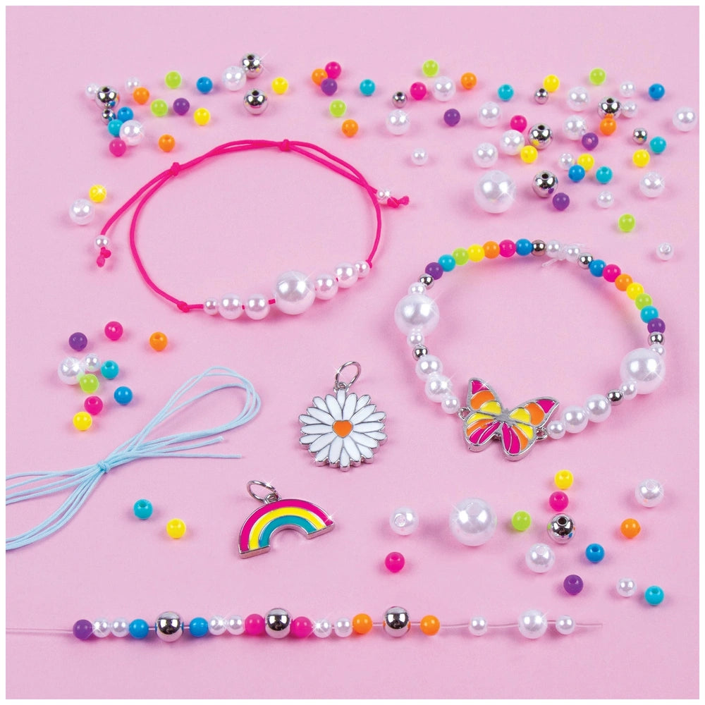 Rainbow Treasure Bracelets featuring metal, glass, and plastic beads, rubber bands, and various metal charms and accessories.