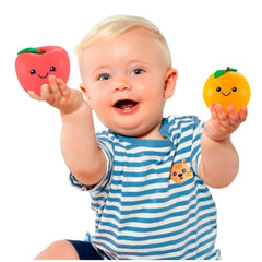 Molto sensorium fruits set with a child holding a red toy fruit, wearing a blue striped shirt, smiling with blonde hair.