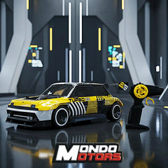 RC Renault 5 Turbo 3E in yellow and black with Turbo 32 decal, featuring black and yellow wheels and interior components.