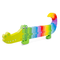 Crocodile alphabet puzzle in green, yellow, and red plastic with letters a-z displayed along its length.