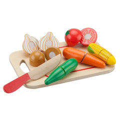 New Classic Toys cutting set featuring a wooden board, plastic knife, carrot, tomato, onion, and garlic for pretend play.