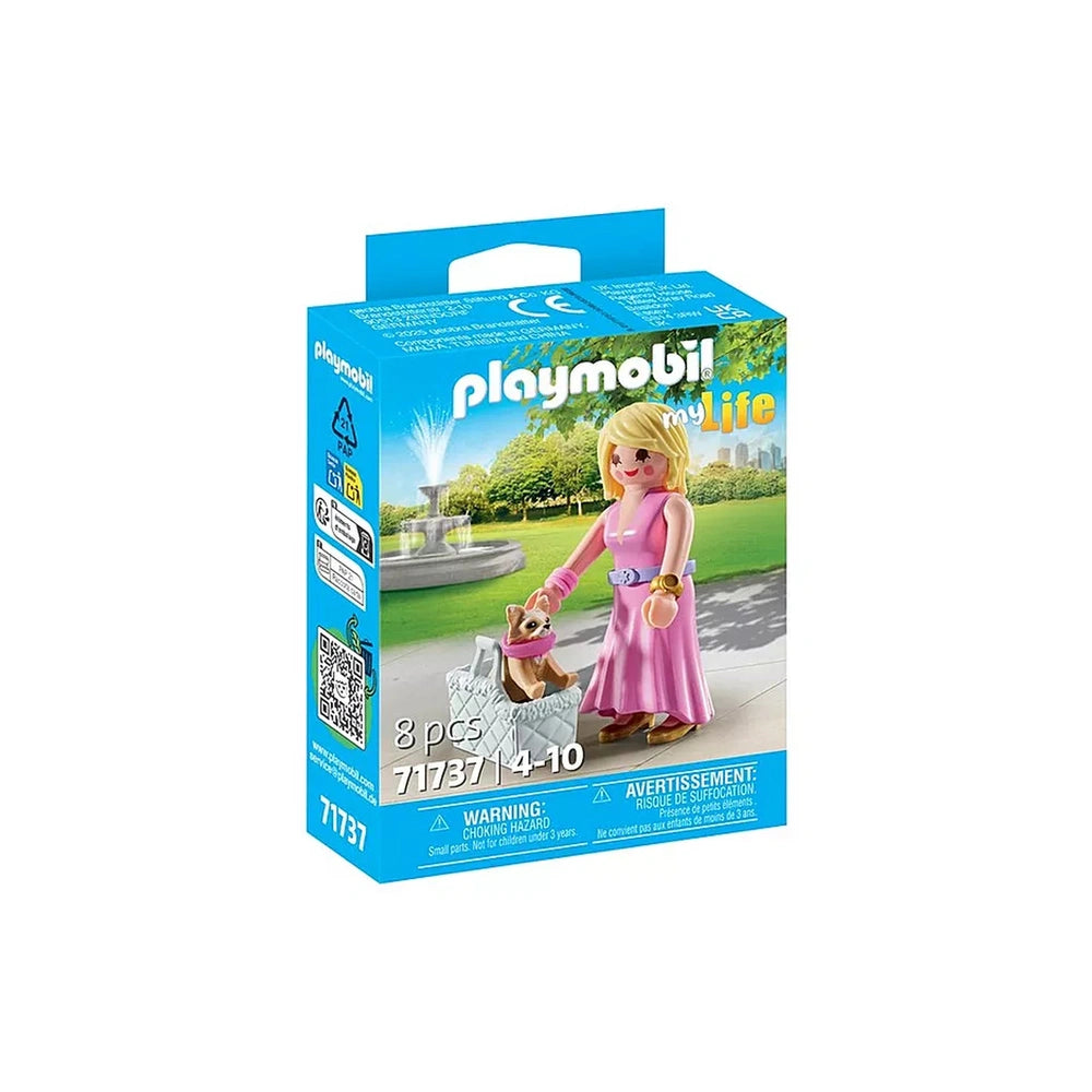 Playmobil It-Girl toy playset features a blonde doll in pink dress holding a purse, displayed in blue packaging with a QR cod