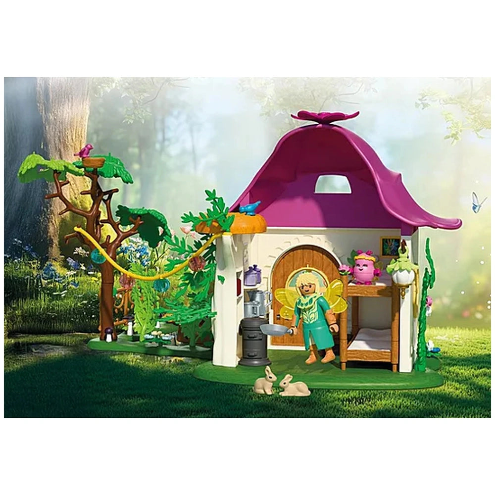 Playmobil Magic Unicorns Cozy Fairy Home features a pink plastic roof and detailed wooden furniture throughout the playhouse.