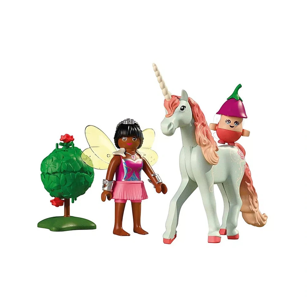 Playmobil Magic Unicorns set features a white unicorn with a pink mane, a green fairy, and a textured tree on a dirt ground.