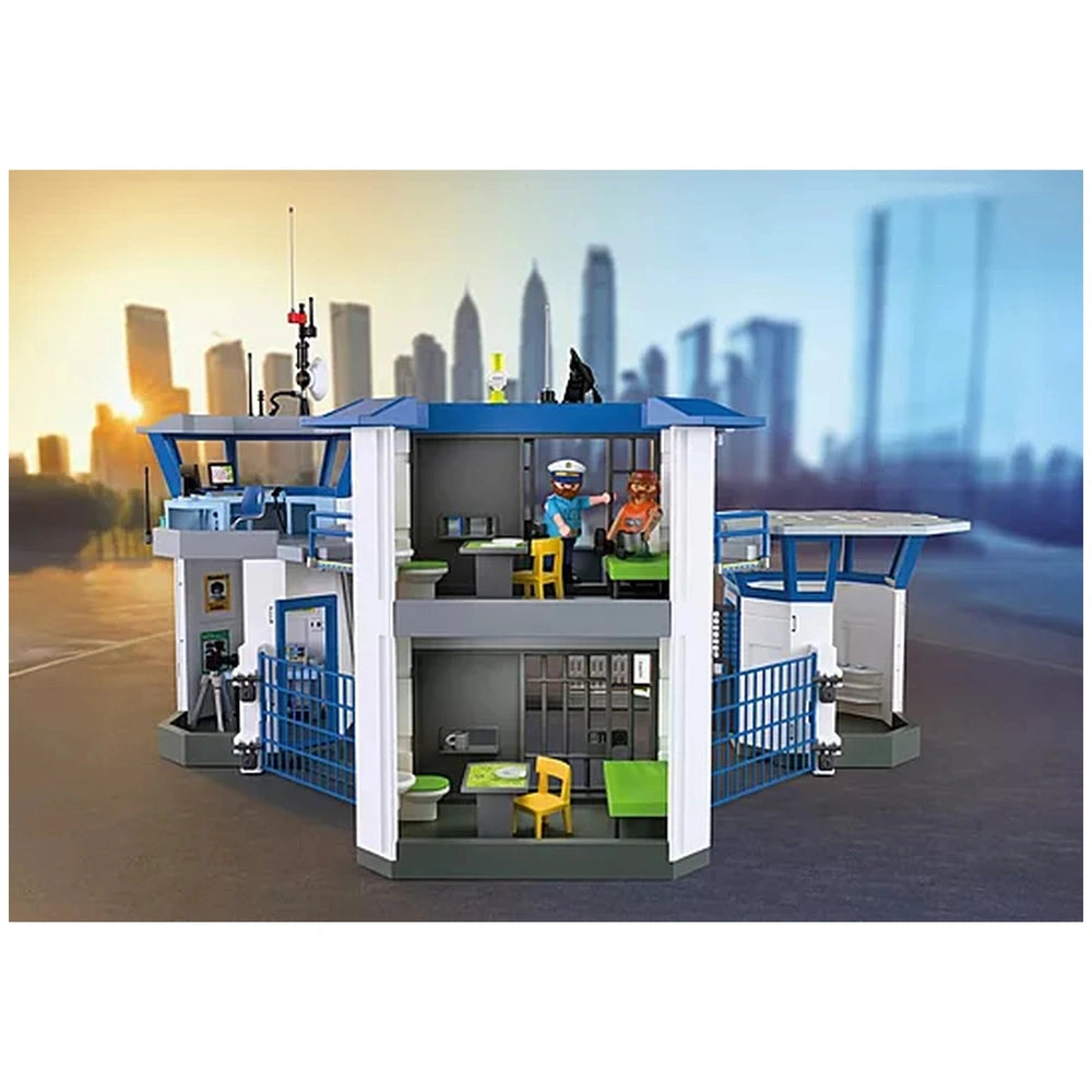 Playmobil Police Command Center features a blue roof, white doors, blue railings, yellow furniture, and a gray floor.