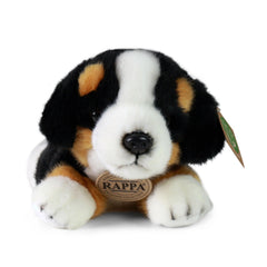 Rappa plush Bernese mountain dog toy, featuring black, white, and brown fur, sitting upright against a light background.