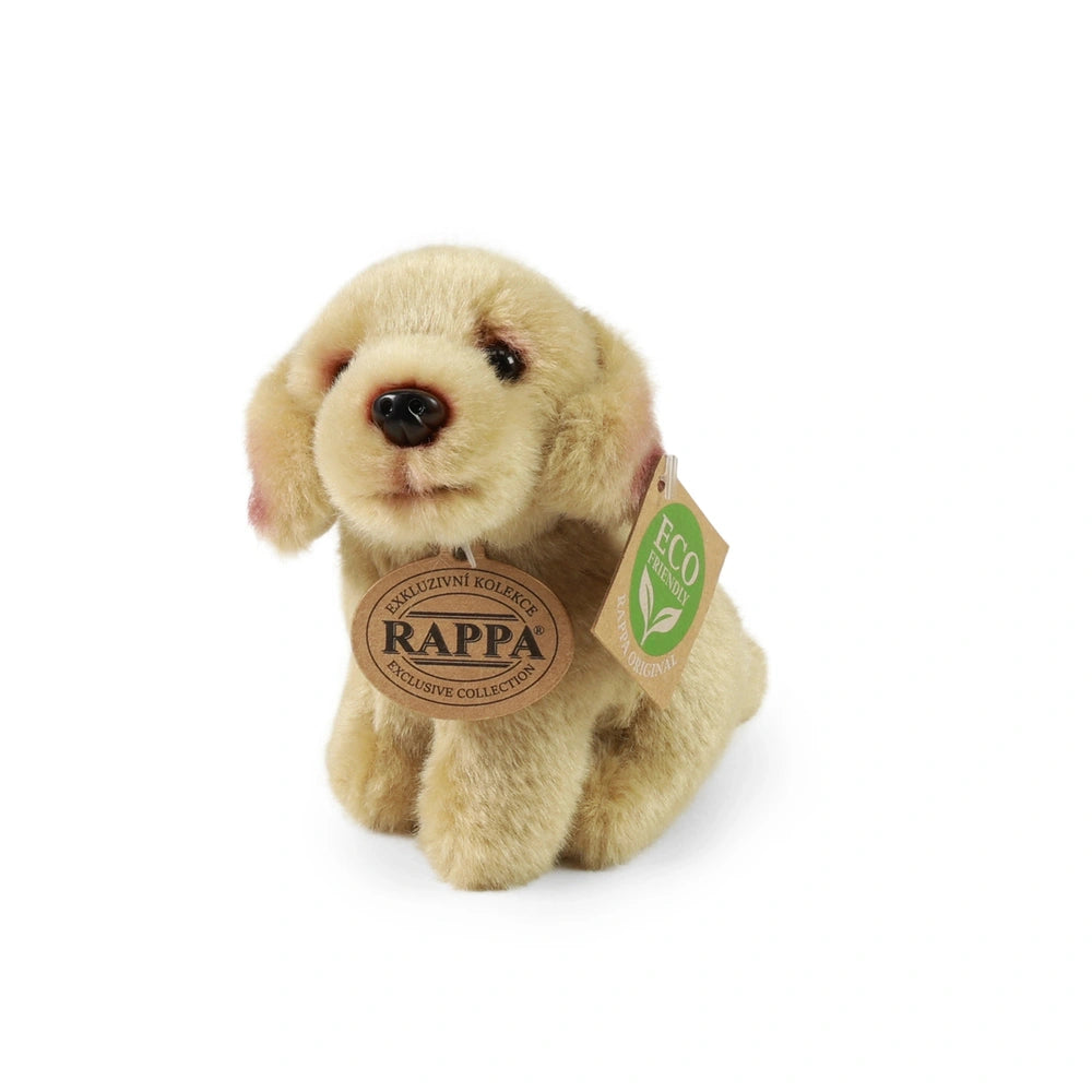 Rappa plush dog toy in light tan with darker ears, featuring an eco-friendly tag, sits against a plain background.