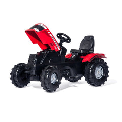 Rollyfarmtrac Mf Tractor is a bright red and black ride-on toy with large wheels and a textured black seat for children.