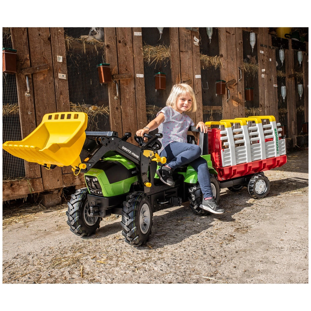 Rollyhay Wagon Pottinger Trailer ATV in green and yellow with a smiling girl in casual clothing, set in a rural background.