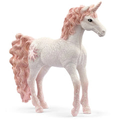 Unicorn figurine with a glossy white body, pink mane and tail, and glittery accents, set against a light background.