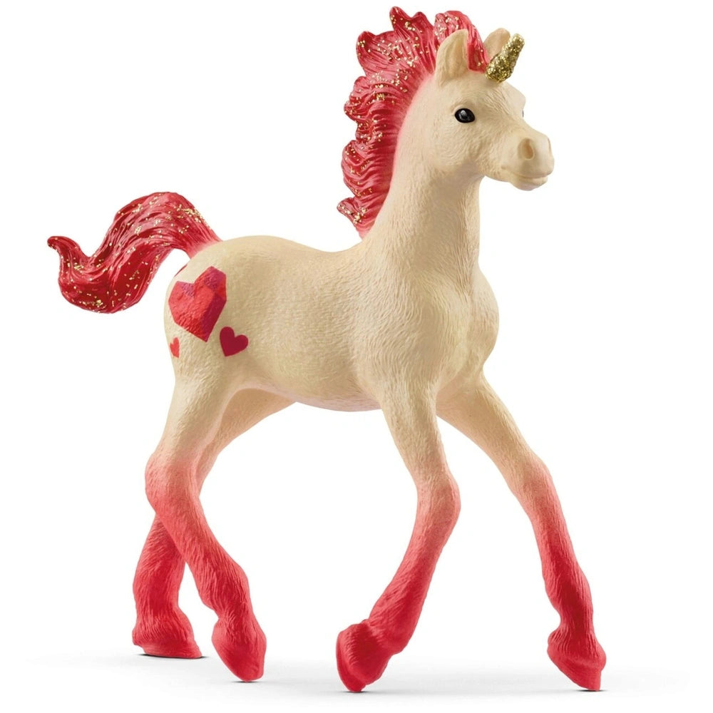 Unicorn figurine with a white body, pink mane, and a heart marking, standing on a light background.