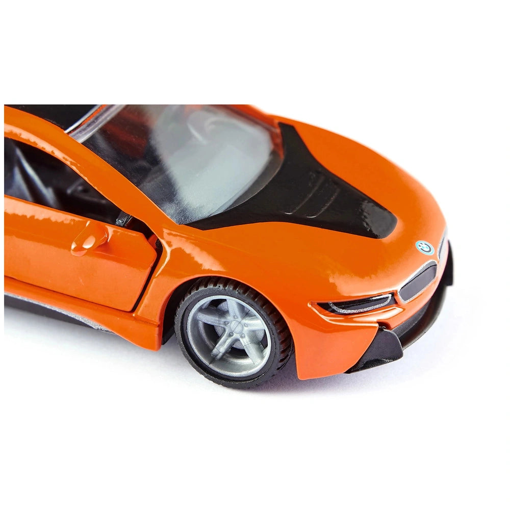 Siku BMW i8 LCI model car features a glossy orange body with black accents and silver wheels, showcasing detailed components.