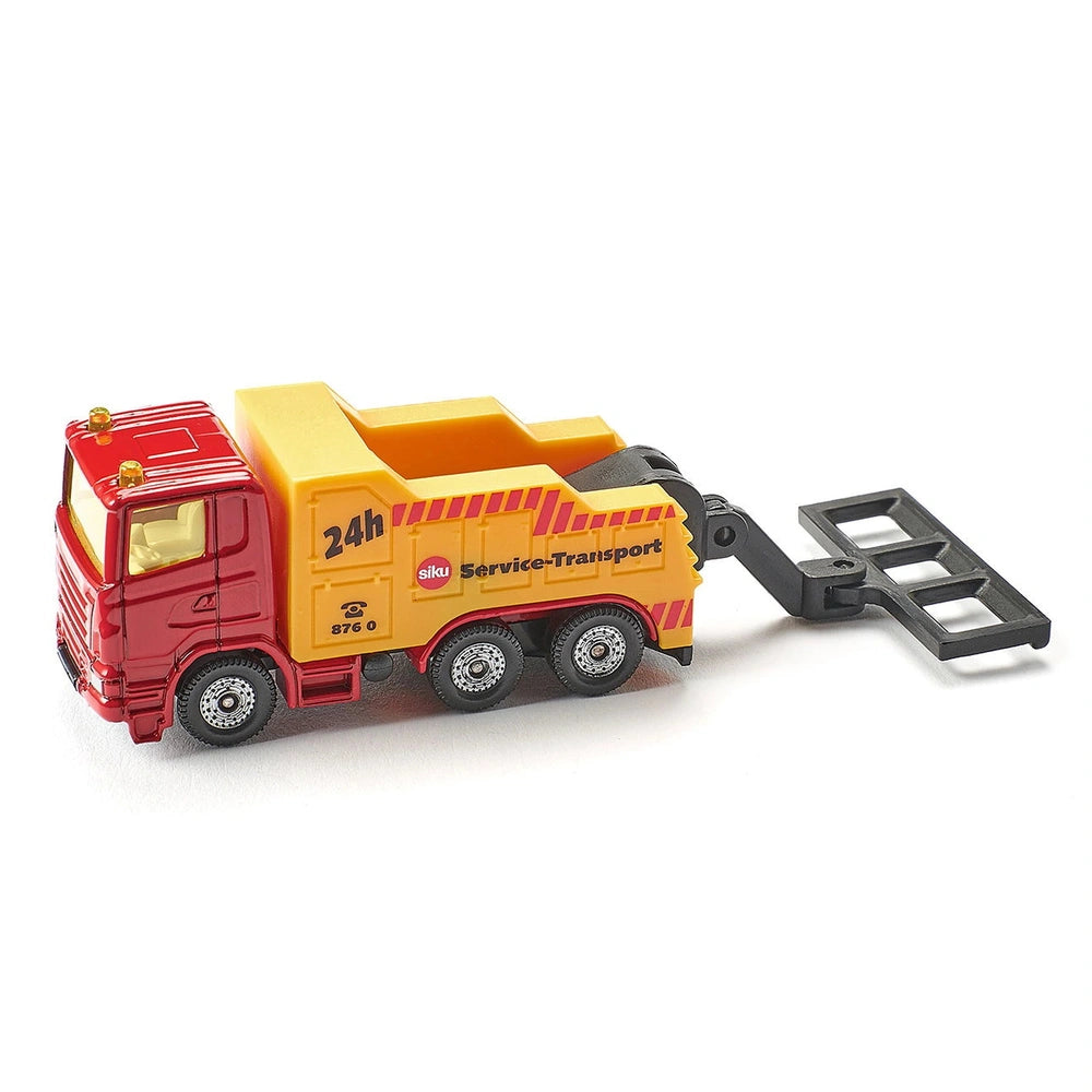 Siku breakdown truck features a yellow cab, red trailer, and "24h Service-Transport" text on a glossy white surface.