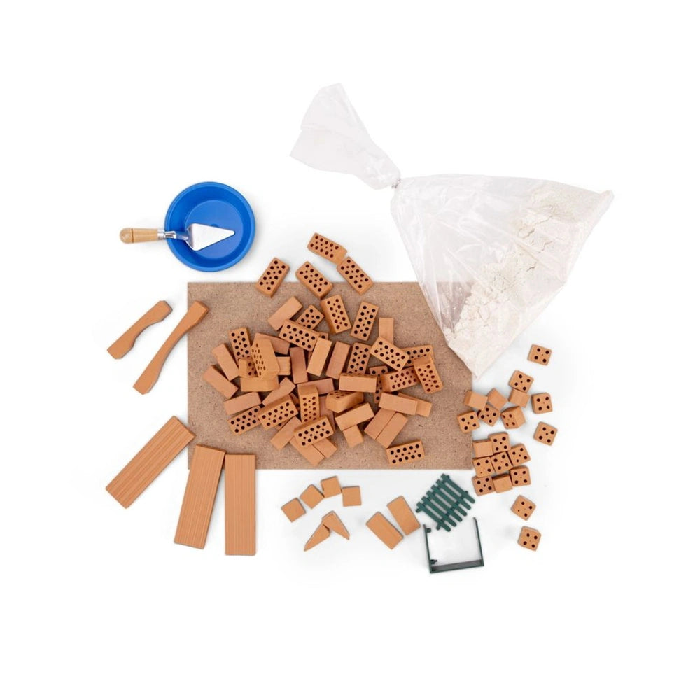 Teifoc Spanish style house kit features brown wooden pegs, small wooden pieces, a blue plastic lid, and an open white bag.