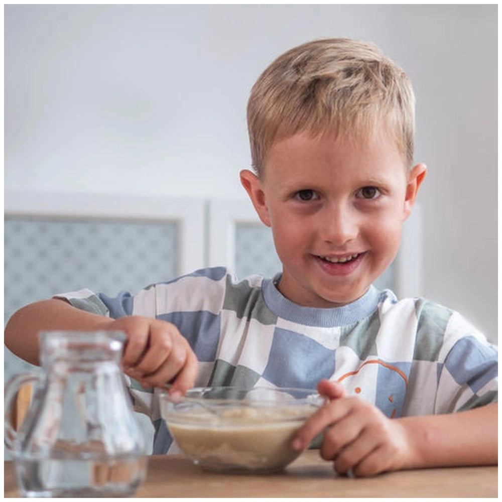 Teifoc water-soluble mortar is showcased as a young boy in a striped shirt enjoys crafting at a wooden table.