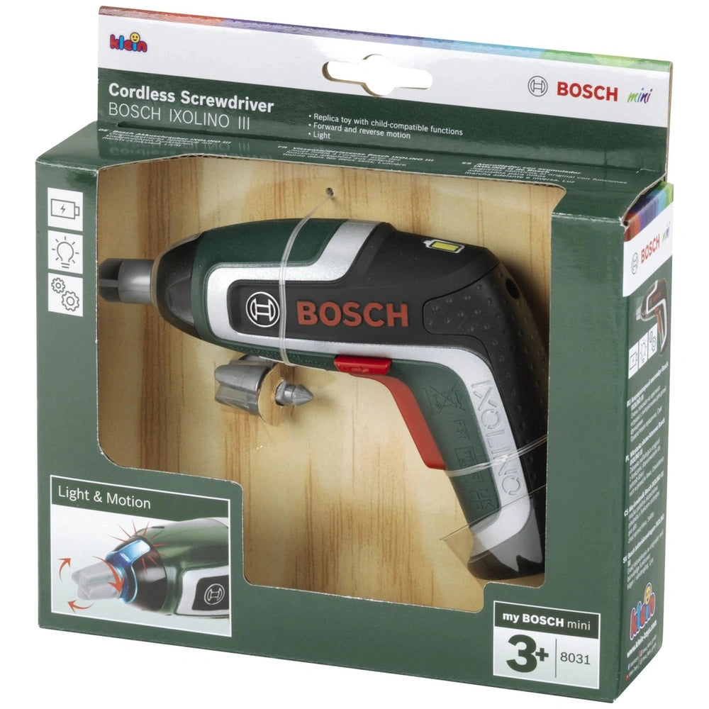 Theo Klein cordless screwdriver toy in green and white packaging, featuring a plastic window and printed child-friendly funct