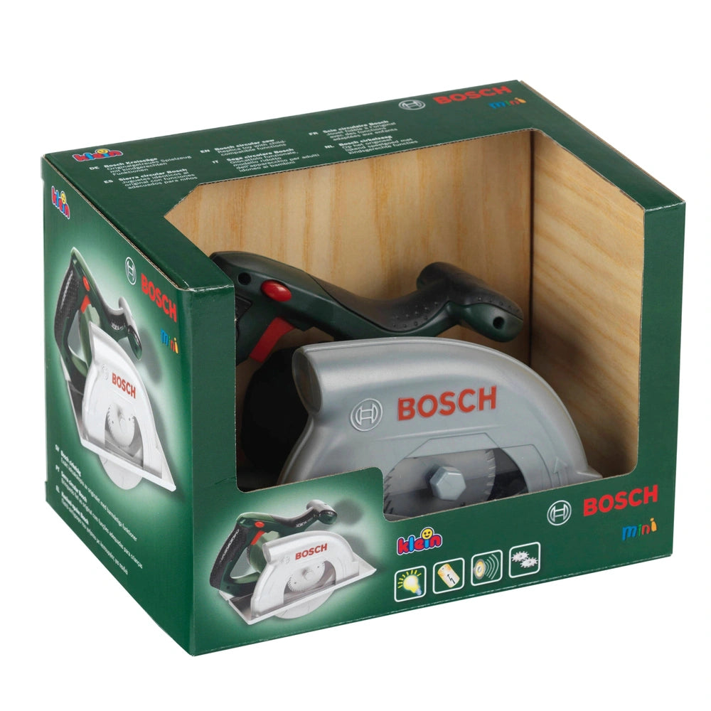 Bosch circular saw toy in green cardboard packaging with a glossy finish and transparent window, featuring safety symbols and