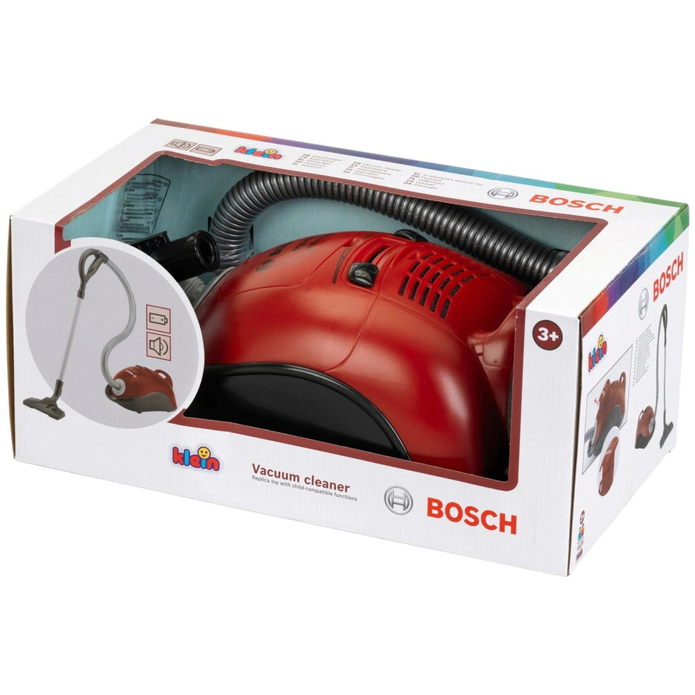 Red Bosch vacuum cleaner in glossy retail packaging with black components, suitable for pretend play, labeled for ages 3+.